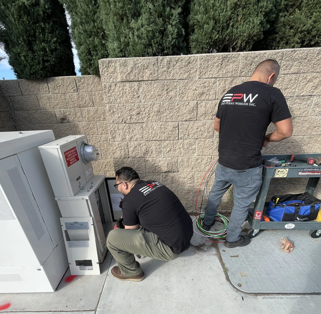 Security professionals installing equipment