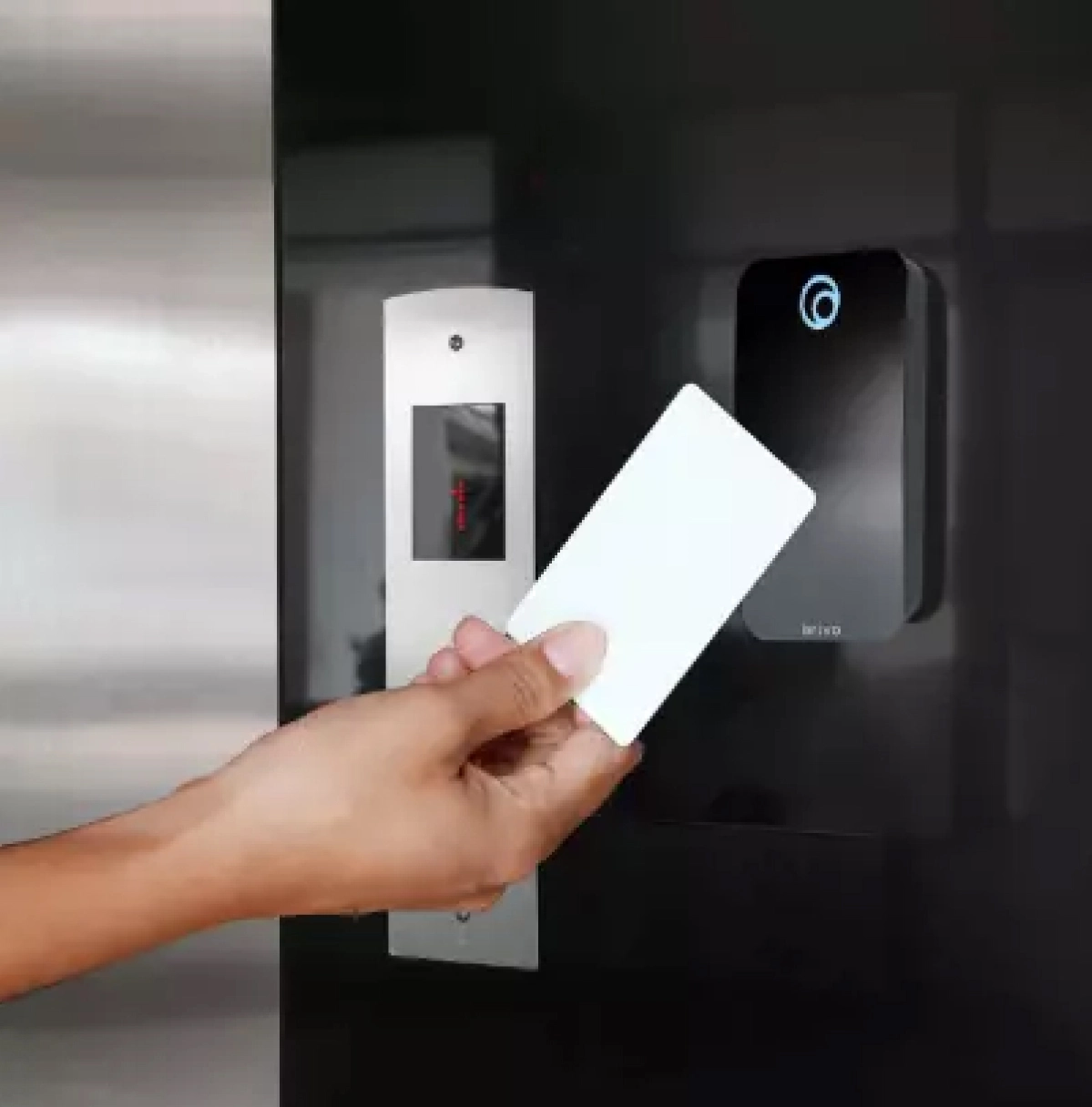 Employee using smartphone with Brivo Mobile Pass to unlock commercial door